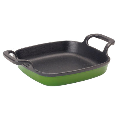 Green enameled cast iron small baking dish with black interior and large side loop handles on a white background