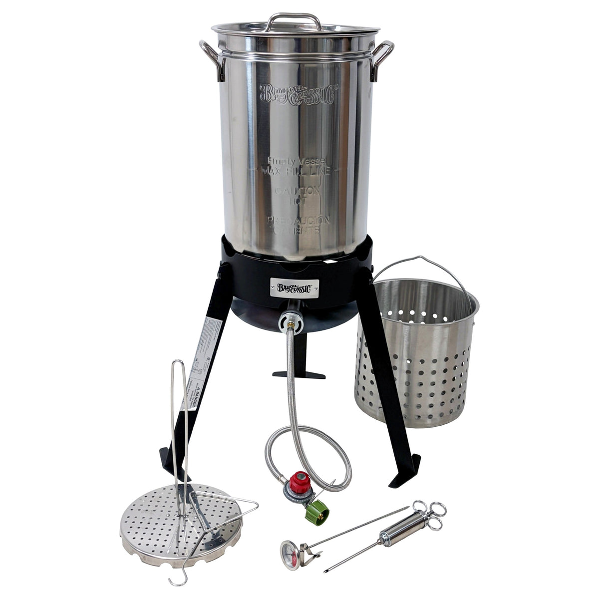 A stainless steel outdoor turkey fryer on a black tripod cooker, including a basket, poultry rack, grab hook, thermometer, and injector on a white background.