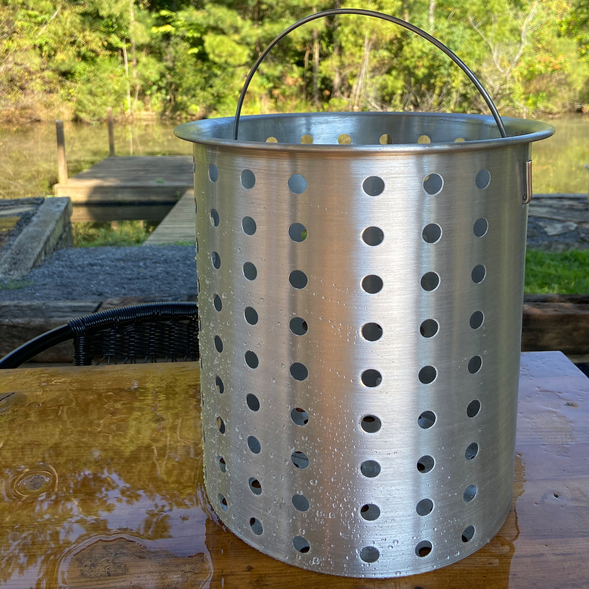 30-qt Accessory Basket outside by a body of water