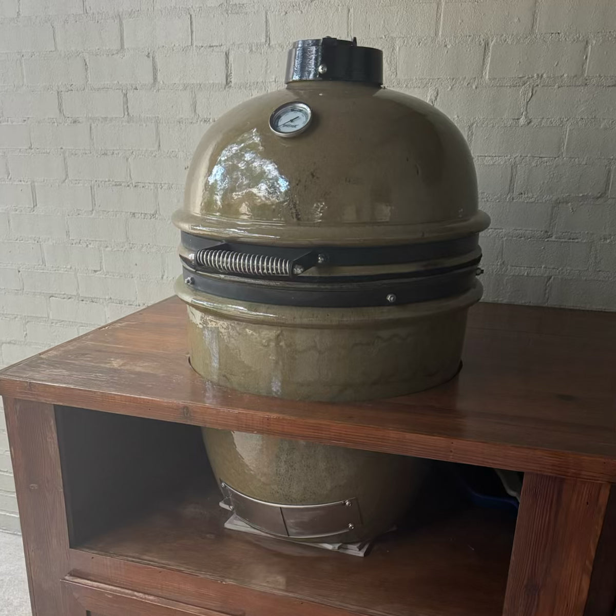 Ceramic kamado style grill installed in an outdoor kitchen