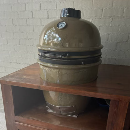 Ceramic kamado style grill installed in an outdoor kitchen