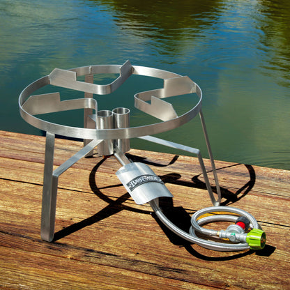 Stainless Dual Jet Cooker on a surface next to a body of water